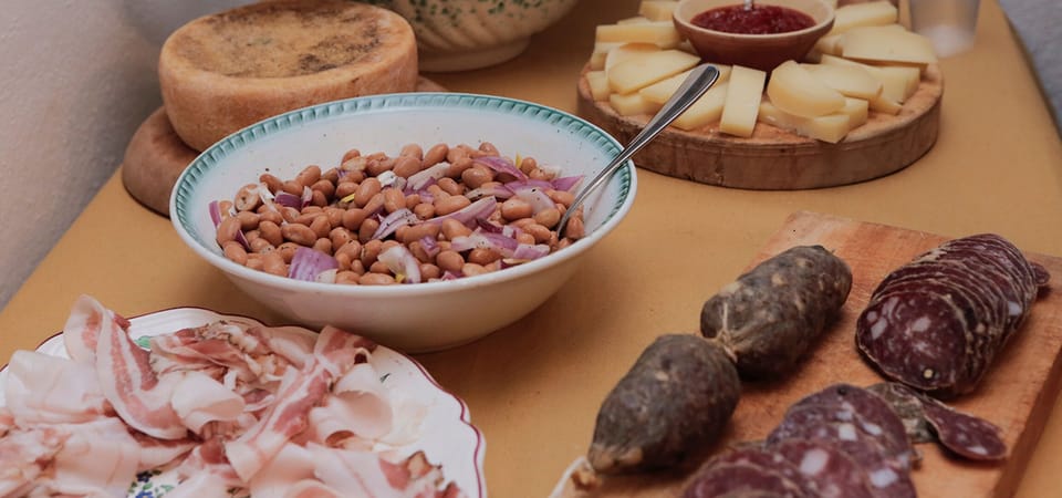 The owner makes wine, salami & cheese in the traditional way. You can try it all