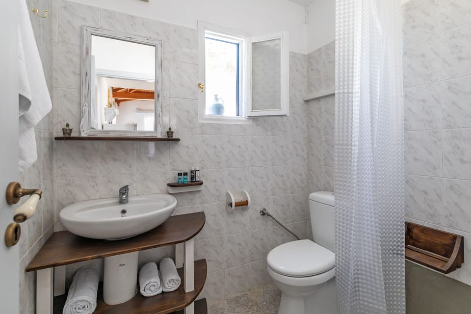 Well-maintained bathroom with all essentials provided.