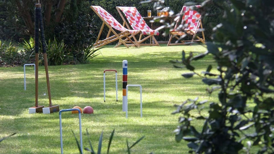 Enjoy a game of croquet or grab a deckchair