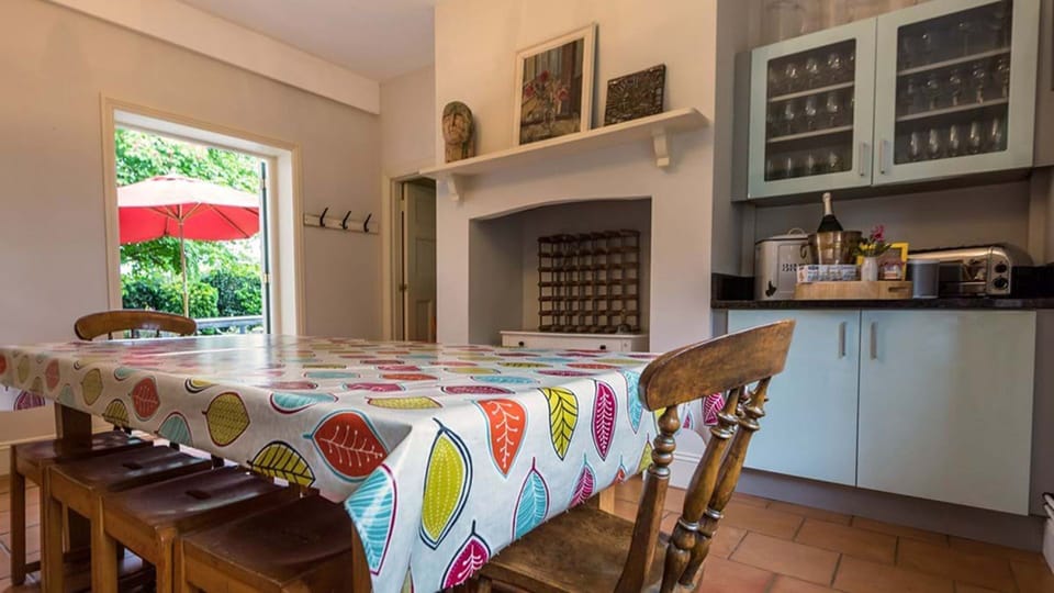 The kitchen leads to a sunny patio for outdoor dining