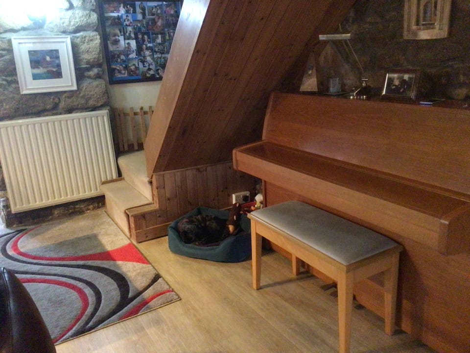 Piano under stairs