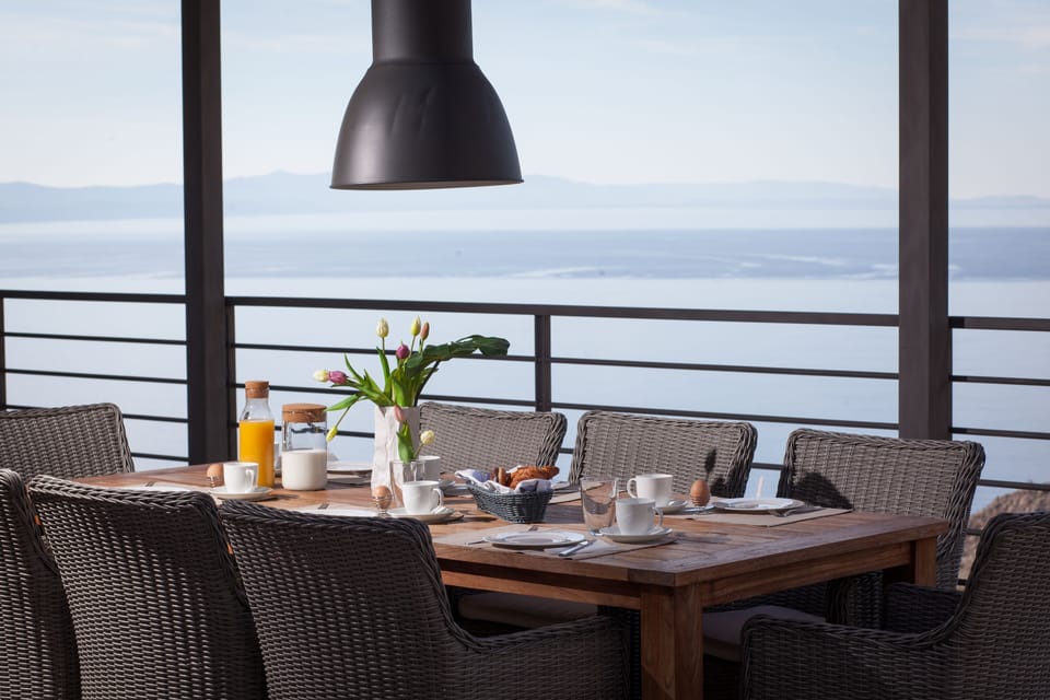 terrace connected to living room and kitchen with outdoor dining table and loung