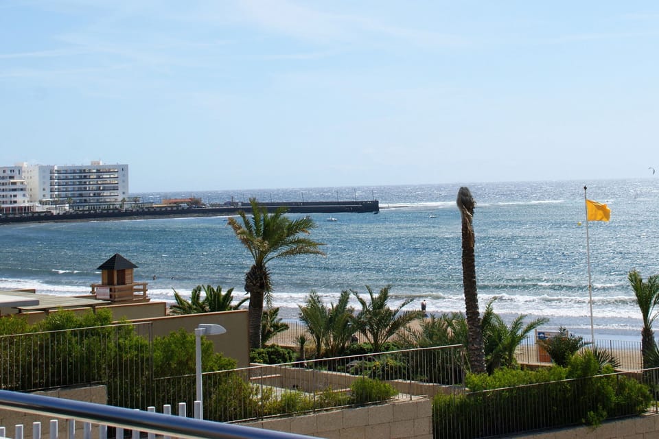 Views of the dock and El Médano Beach from the terrace