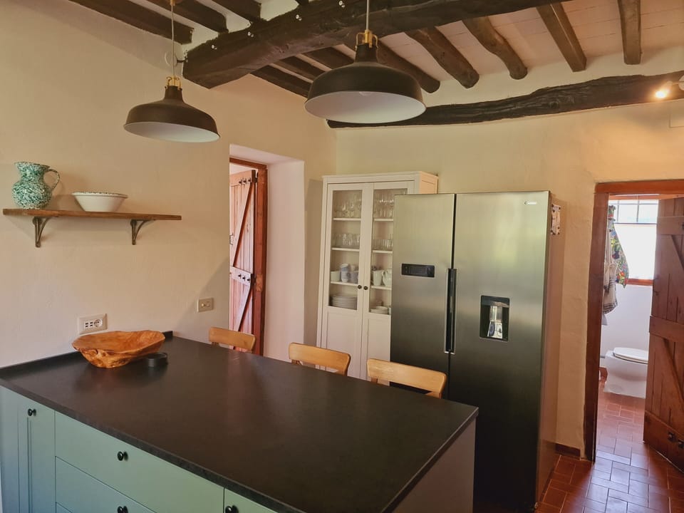 Bright and spacious it has an American style fridge with ice maker