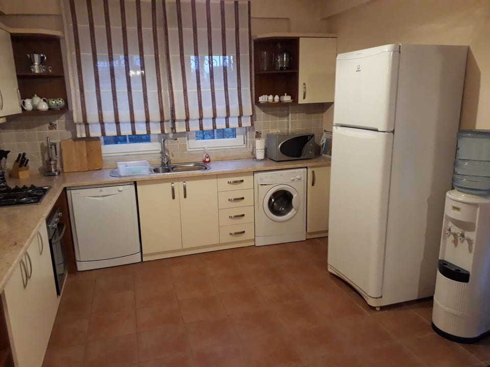 Kitchen showing water cooler.