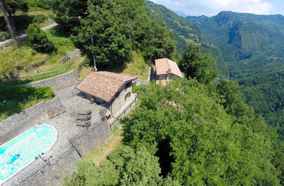 ENTRANCE GATE AT TOP LEFT, FRONT POOL, METATO THEN FARMHOUSE VALLEY BEHIND