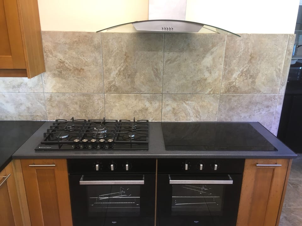 TWO SETS OF HOBS: ONE GAS SET AND ONE ELECTRIC SET