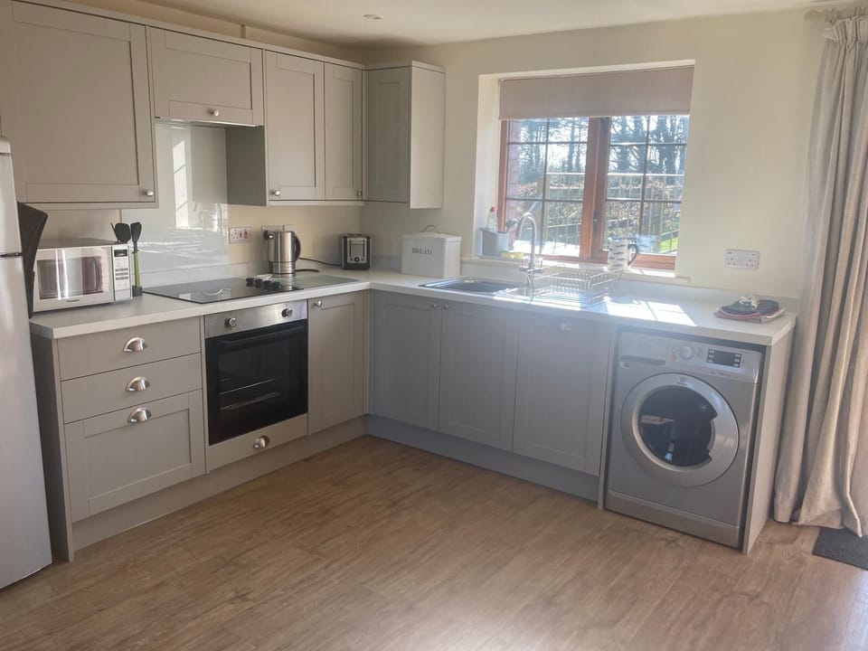 Newly fitted bright and spacious kitchen with integrated dishwasher