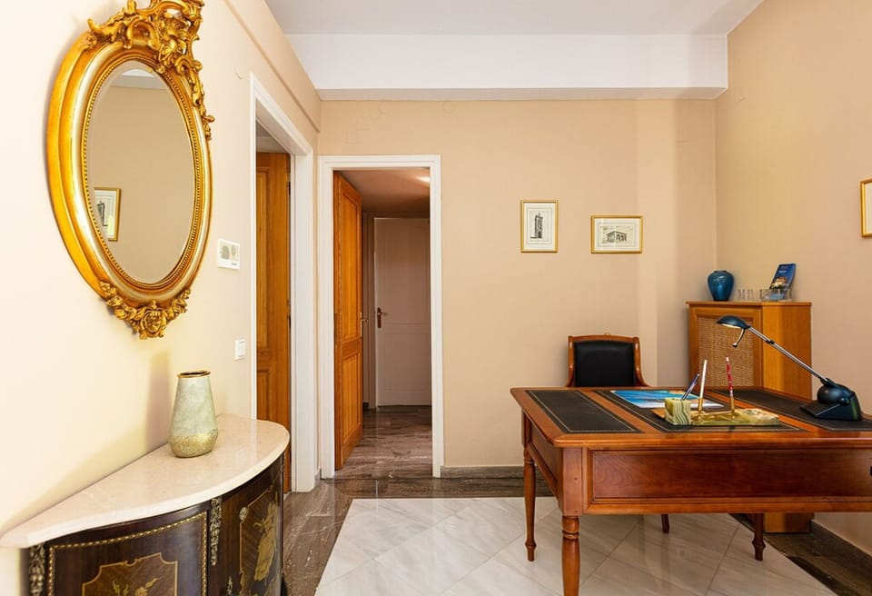 The right side of the ground floor also hosts an office space.