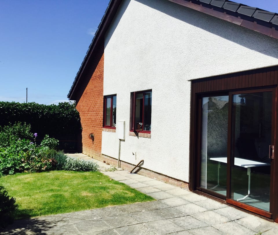 The secluded rear garden and patio area