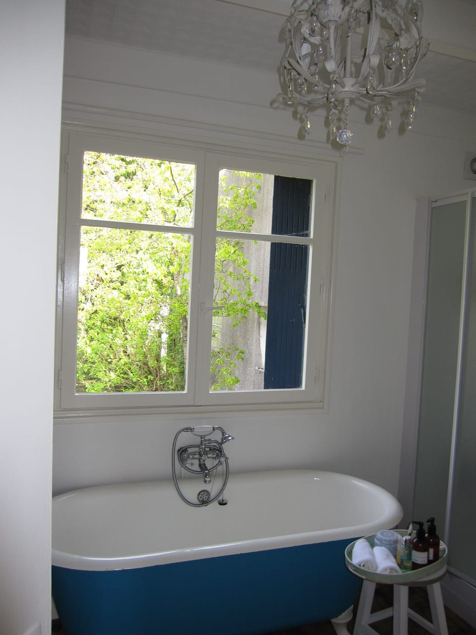 upstairs bathroom with roll top bath and shower box