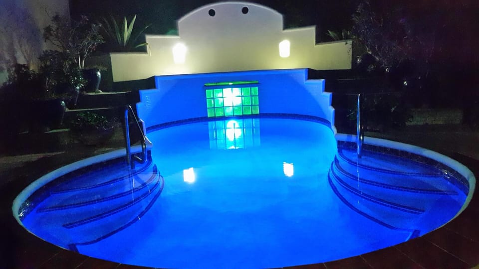 Pool at Diamond Oasis at night
