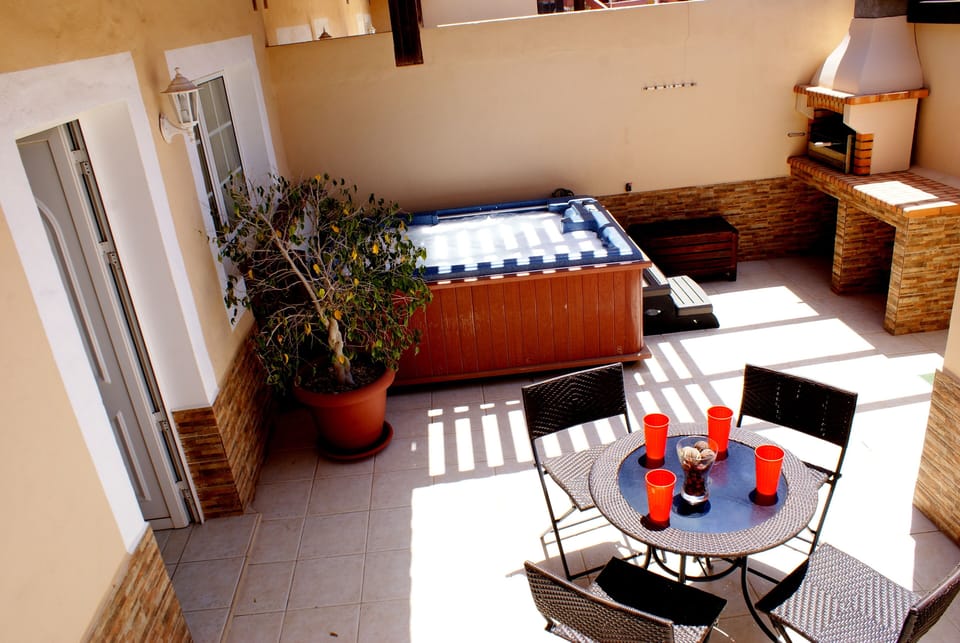 Front terrace - Secludes Hot Tub, BBQ, seating.