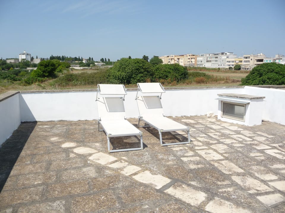Sunloungers on large private roof terrace with 270 degree views & lovely sunsets