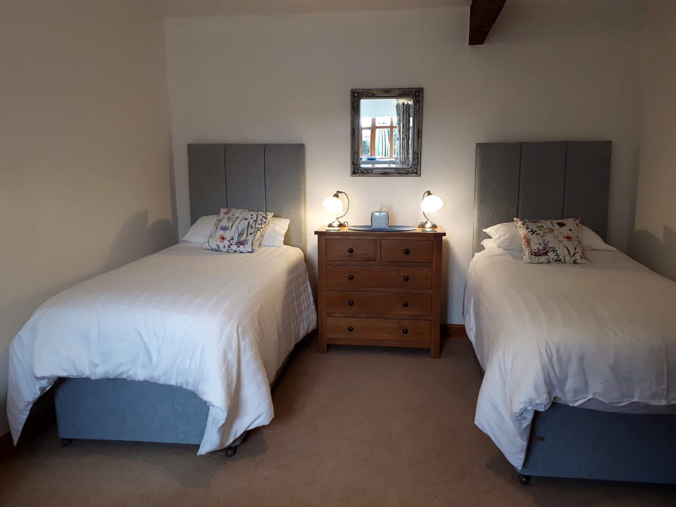 Twin Bedroom with Zip n Link for super king option. Third single bed available