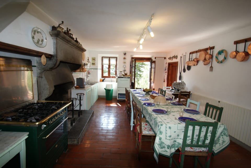 The kitchen and long breakfast table
