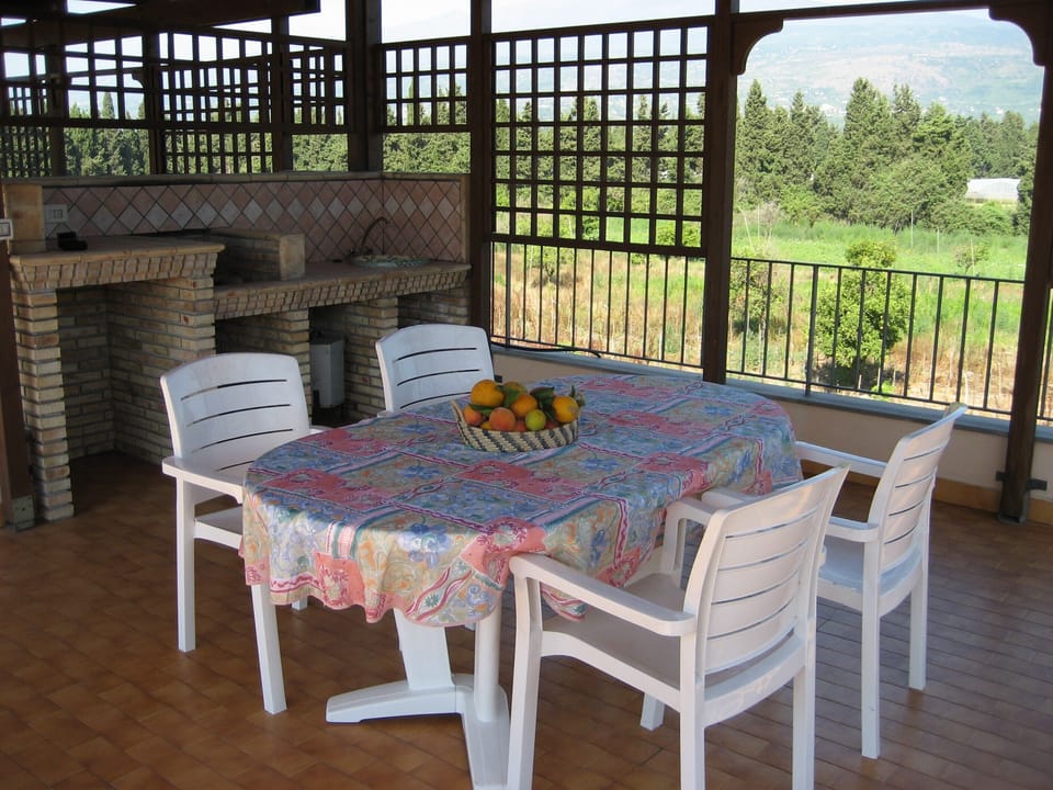 roof terrace with barbecue, table and chairs