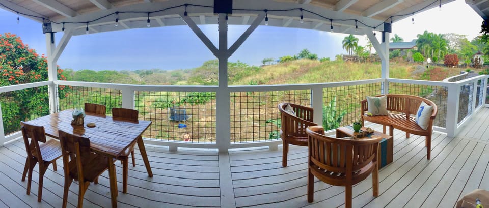 Large lanai with dining table and BBQ