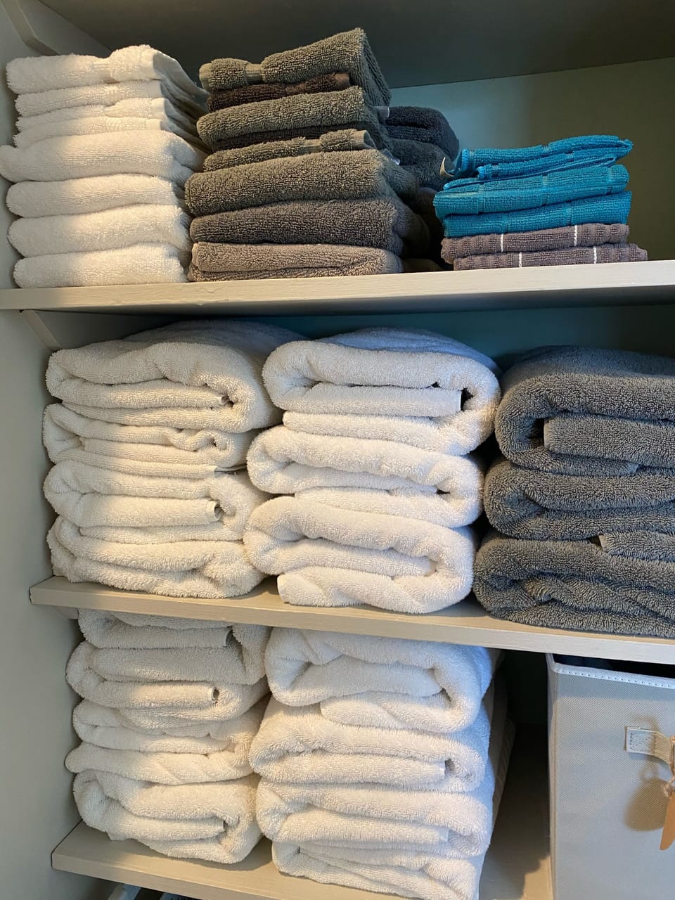 Linen closet holds all of the towels and other paper products you need. 