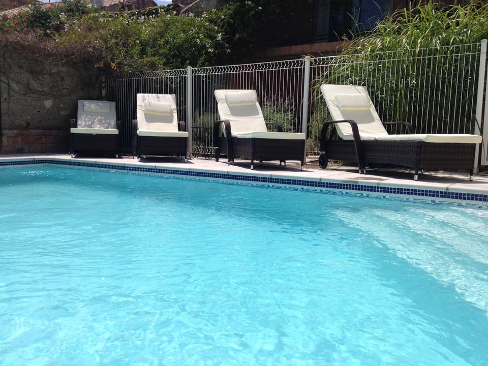 In ground 6x3.5m mosaic tiled pool sits in private walled courtyard