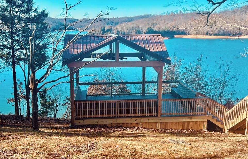 New deck with fan, electrical outlets, and view.