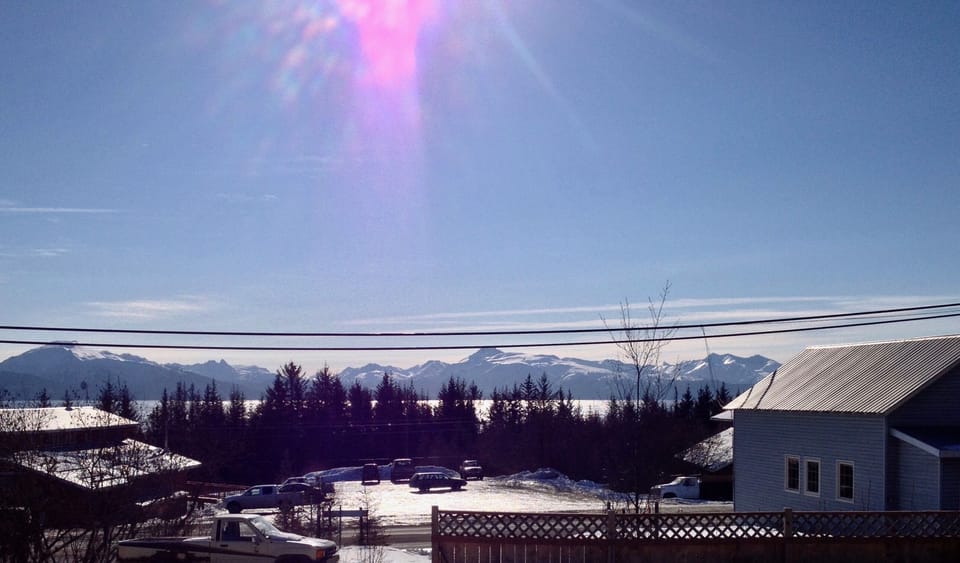 View of the Bay and Kenai mountains from the deck
