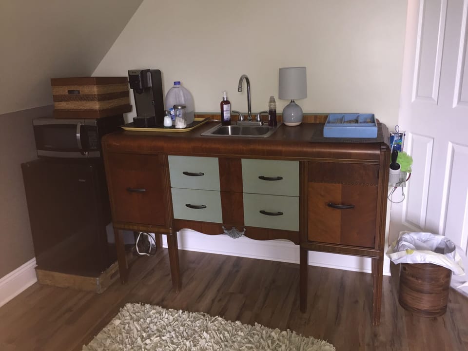 Kitchenette has a dorm-sized fridge, microwave, dishes and a Keruig with k-cups!