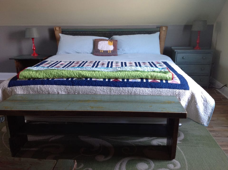 King bed is very comfortable and layered with cozy linens and plenty of pillows 