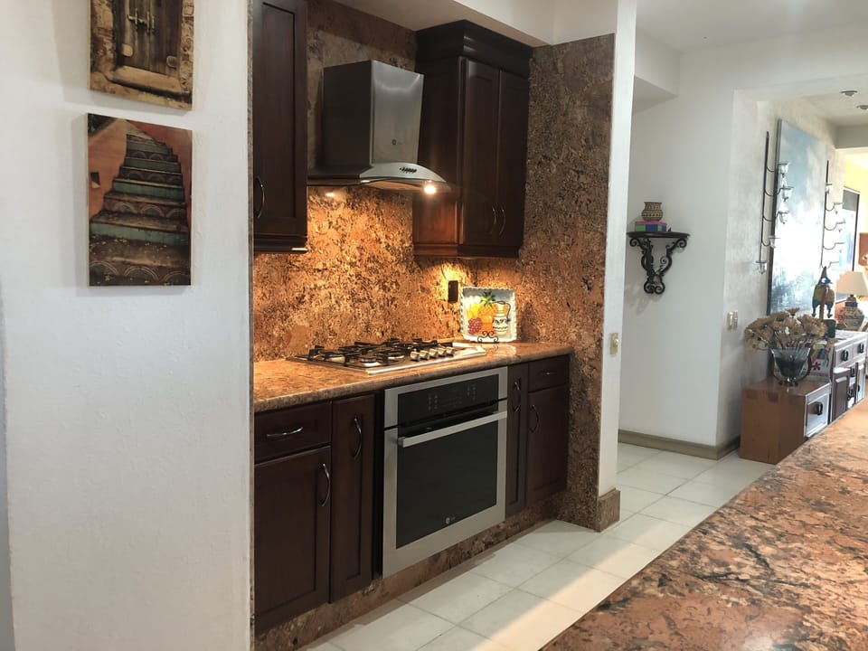 Stove and oven, granite counter top and backsplash