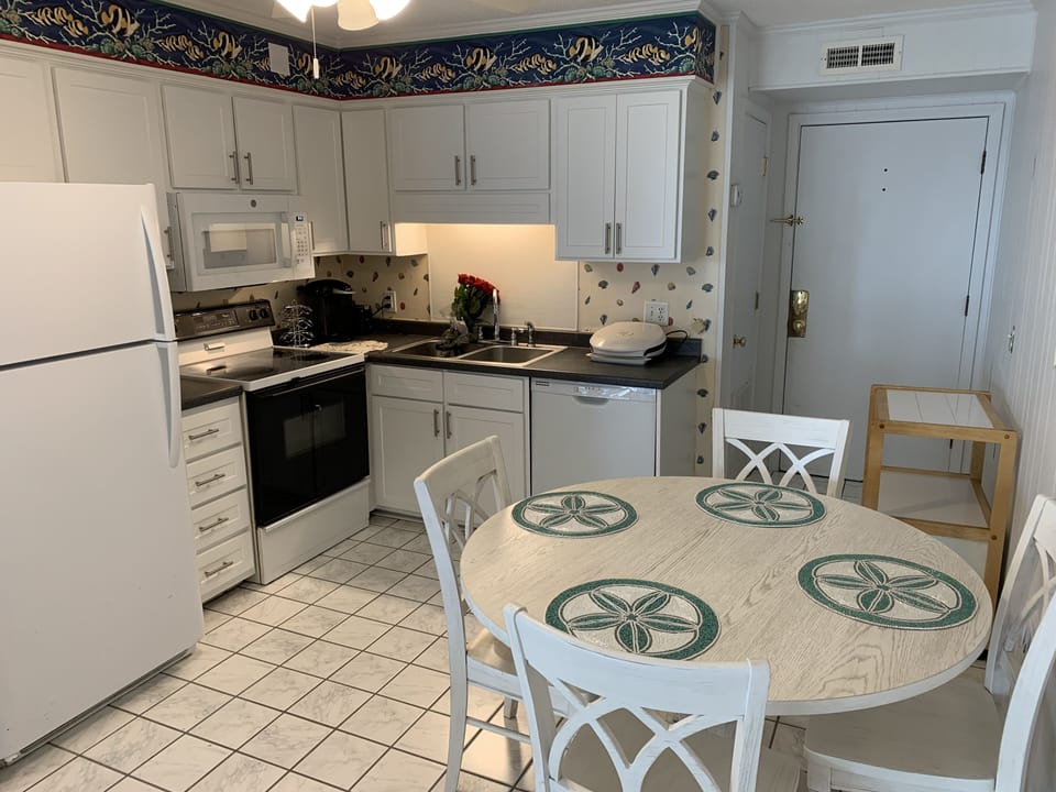NEW KITCHEN TABLE, OLD COUNTER TOPS AND STOVE. 