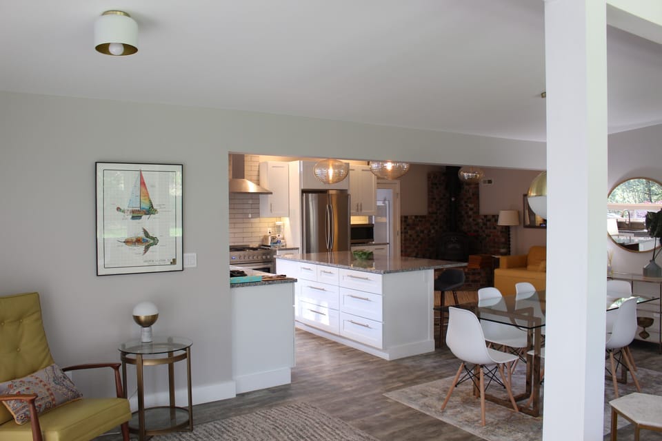 Kitchen, wood stove gathering area and dining area 