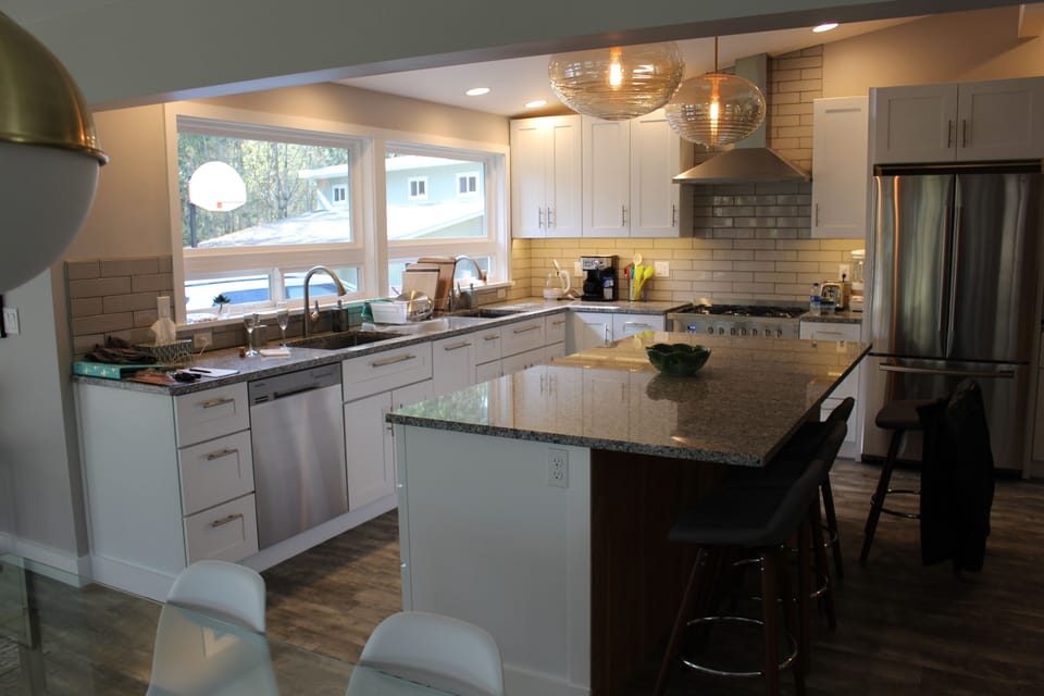 Kitchen with two sinks, gas range and huge island