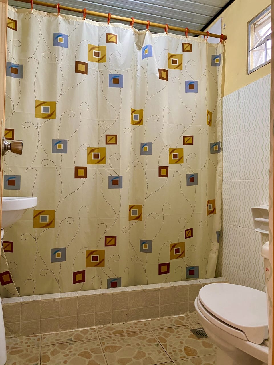 Guest toilet with hot water and shower.