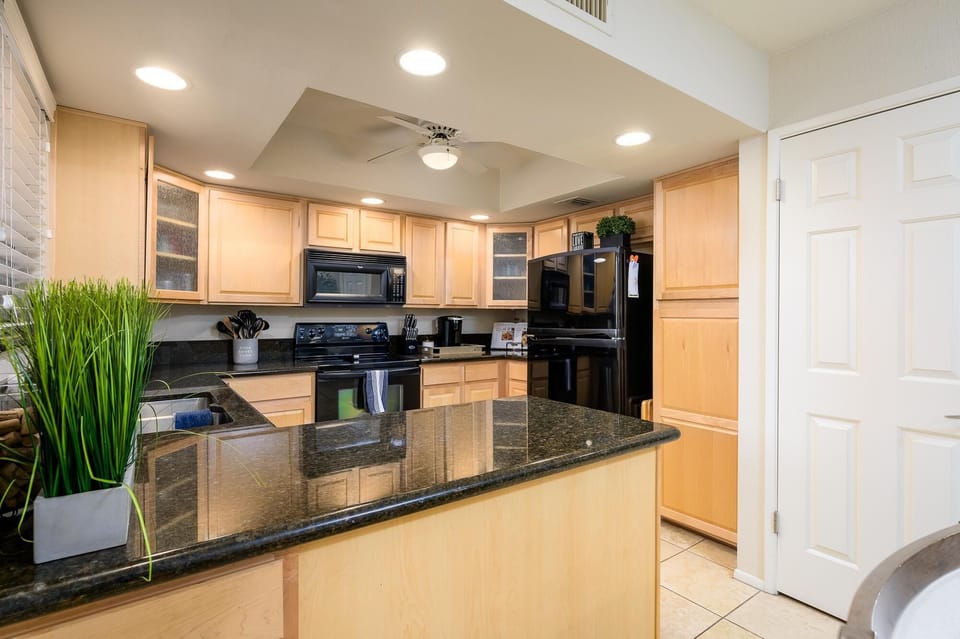 Updated kitchen with granite counter tops.