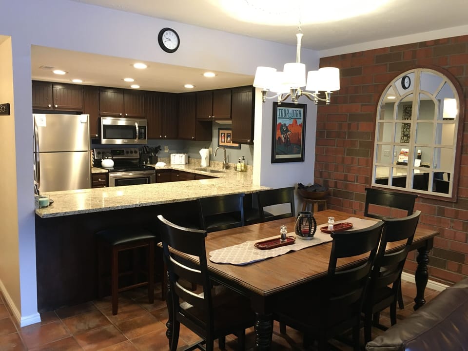 New Dining Table to seat 6 people, plus 4 barstools at the breakfast bar.