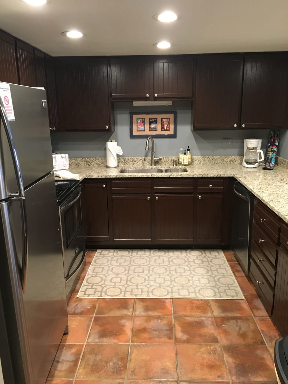 Newly renovated kitchen w/granite countertops & full stainless steel appliances.
