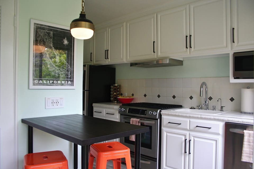 Kitchen with counter height table.