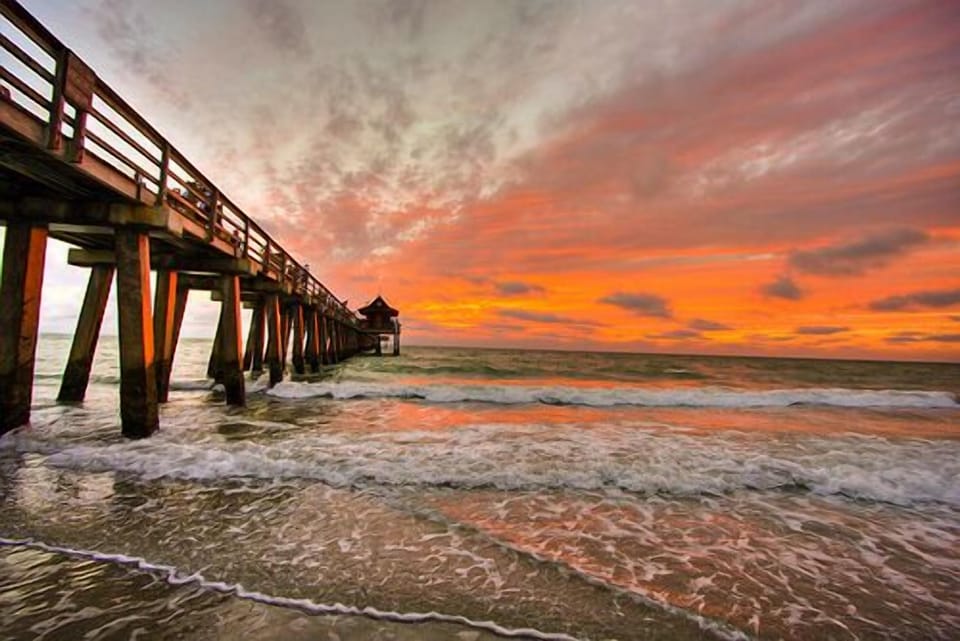 Naples Pier at sunset. Something you must experience during your stay