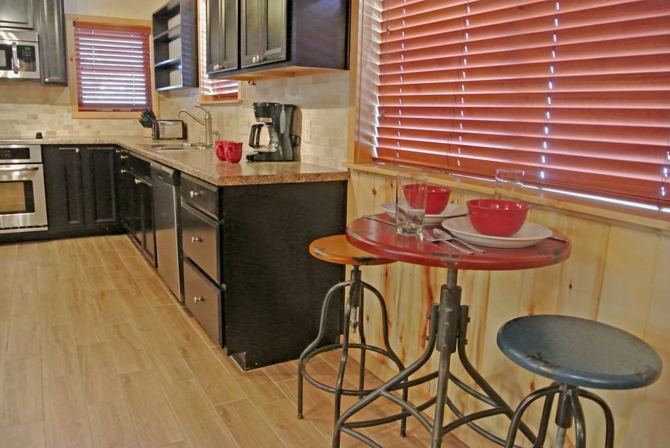 Your fully-equipped kitchen features sleek granite countertops, modern appliances, and a charming breakfast nook where you can savor your morning coffee with a view.