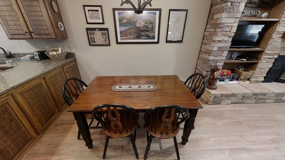 Gather around this rustic dining table for meals, where you'll find warm wood tones and charming décor creating a welcoming space for your group to share stories and laughter.