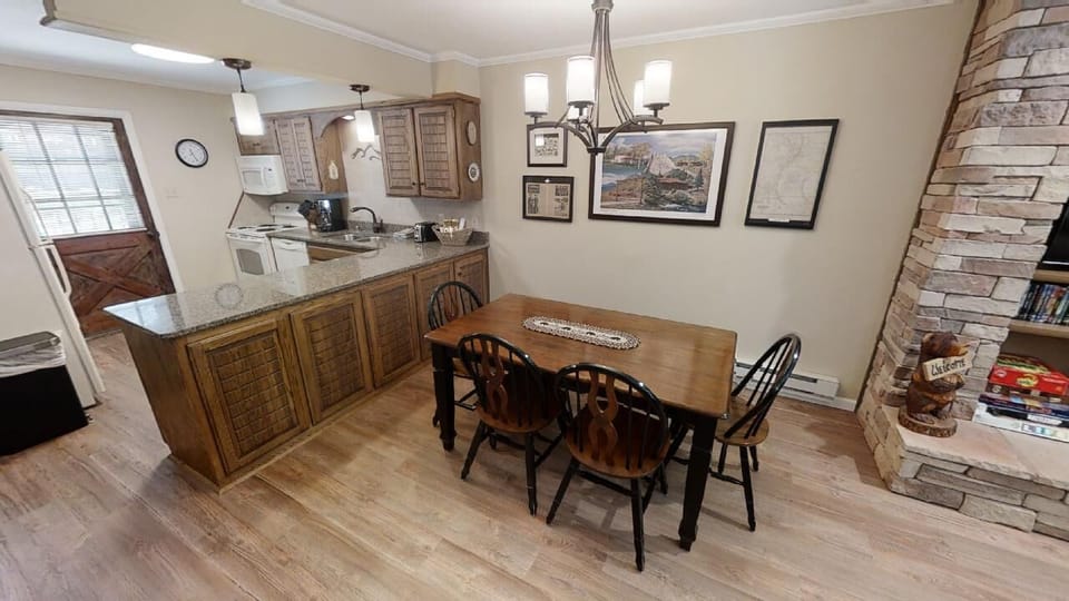 Gather around the dining table for meals together, then whip up your favorite recipes in your fully equipped kitchenette. The warm fireplace creates a cozy, relaxed atmosphere perfect for unwinding after exploring.