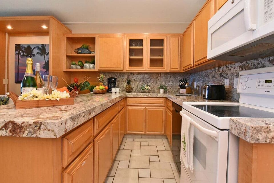 Enjoy cooking at your fully equipped kitchen with wooden cabinets
