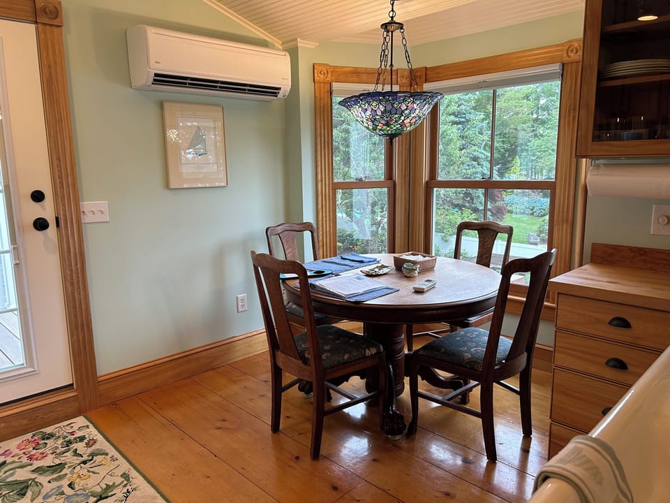 Eat-in kitchen with oak table and chairs, stained glass chandelier