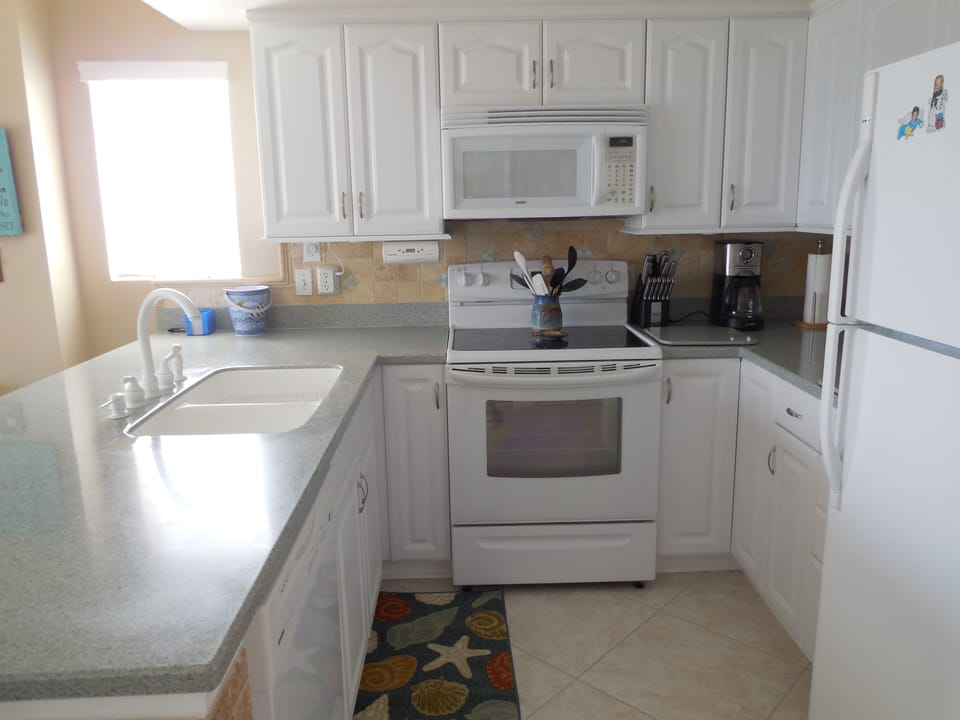 Fully equipped kitchen with every appliance and utensil you could ever want
