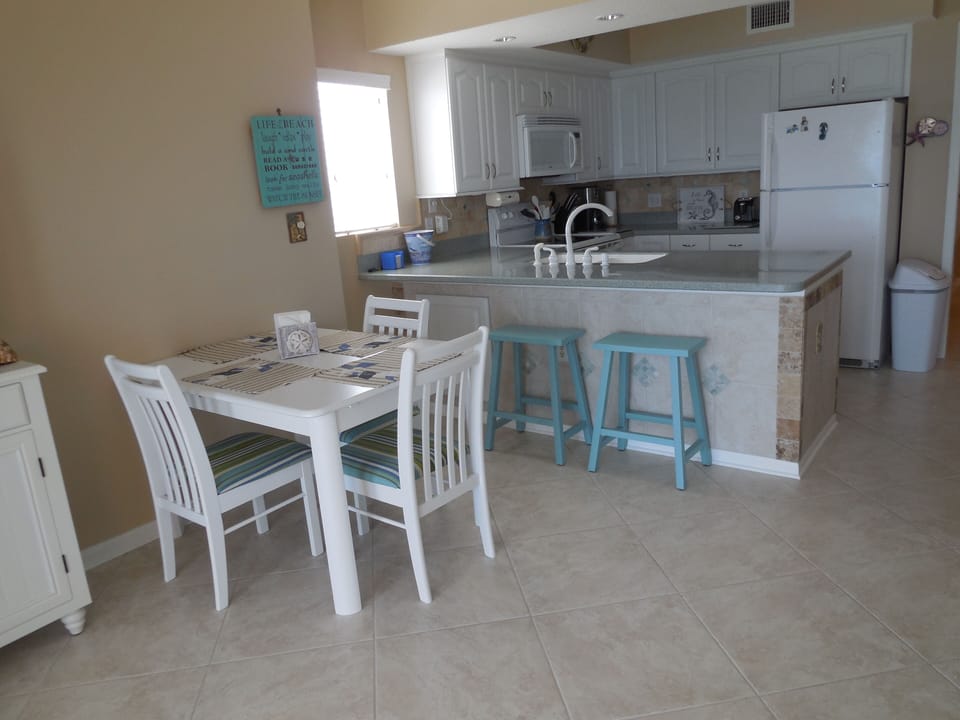 Dining area with bar stools, seating for six