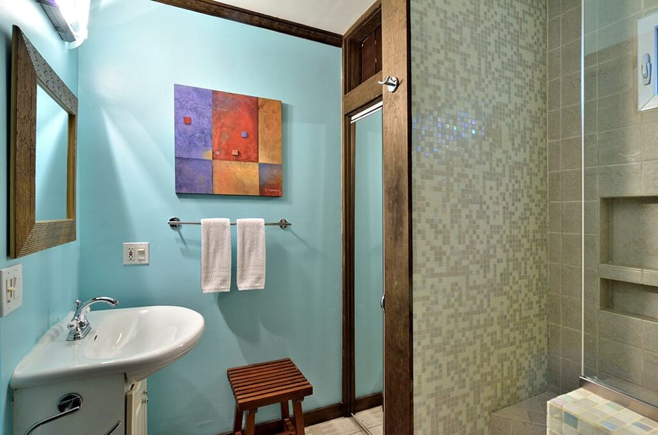 The bathroom features an over sized shower.
