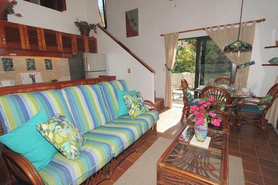 This photo shows the living area out to the side deck