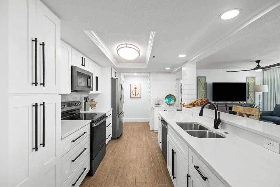 Beautifully remodeled kitchen with all new appliances, countertops, backsplash