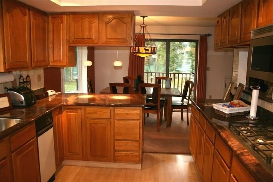 The granite kitchen and dinning area have a great river view