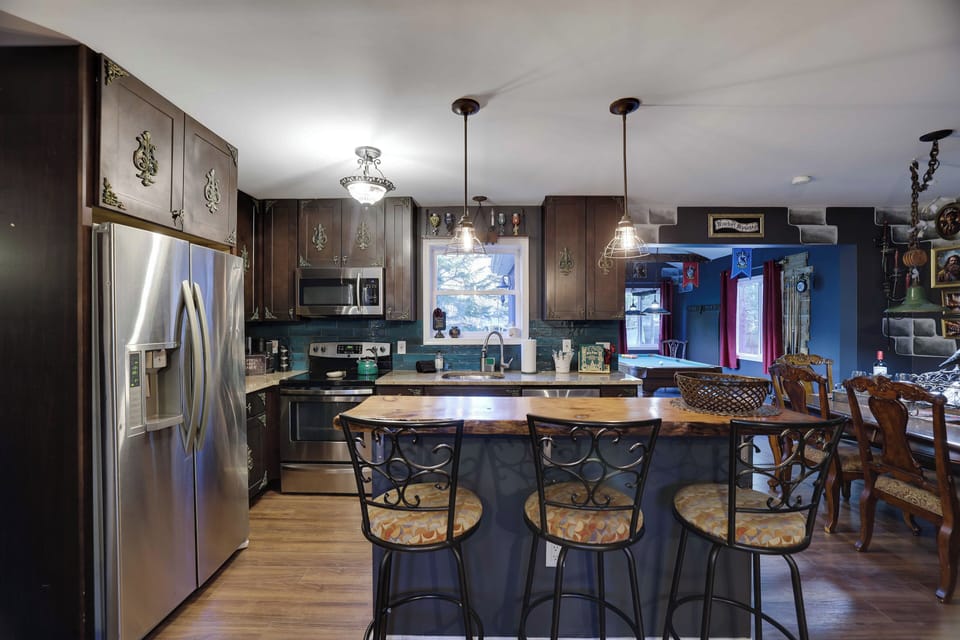 Enchanted cabinets and granite countertops add charm and functionality. 